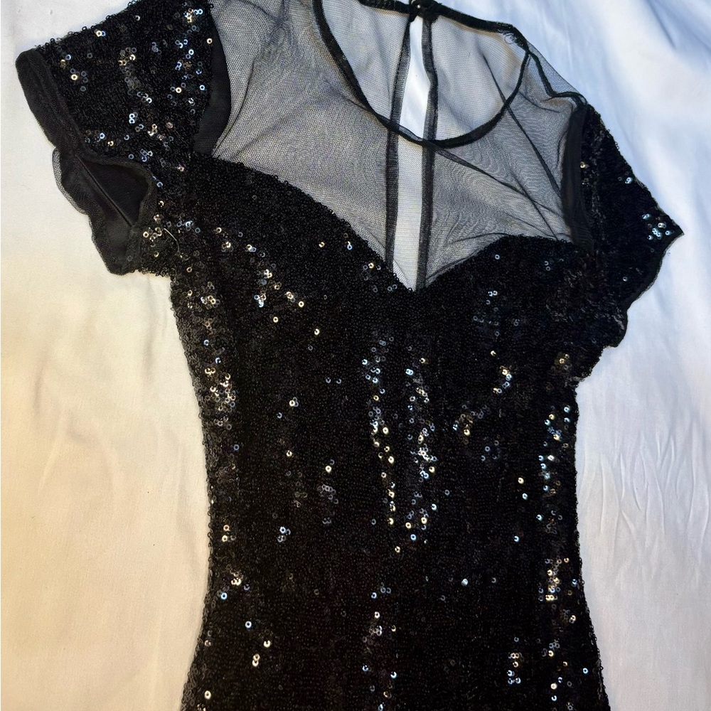 Size 1/2 Black dress with glittery sequins and sheer neckline. Holiday dress